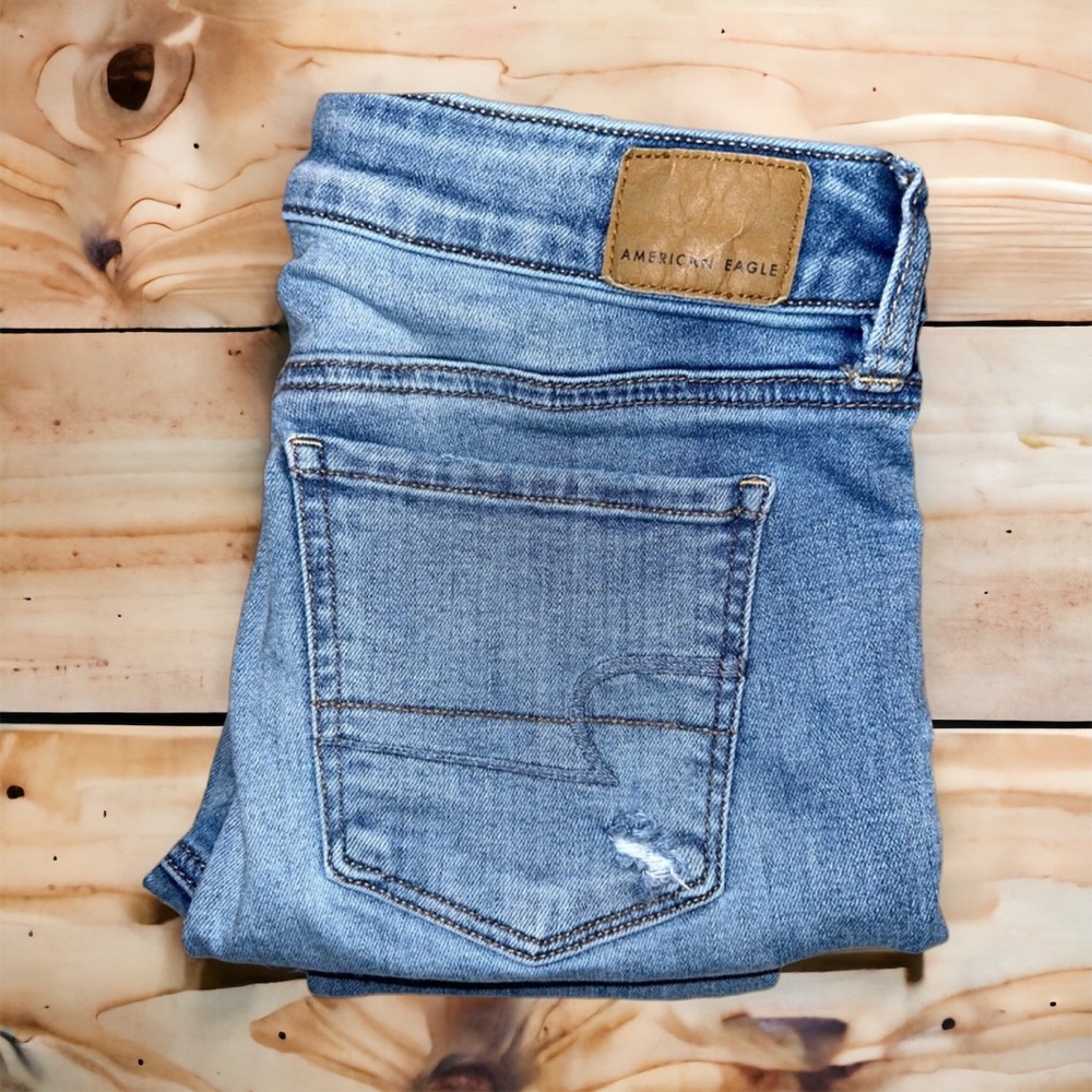 6xl American Eagle” Distressed Jegging Jeans.